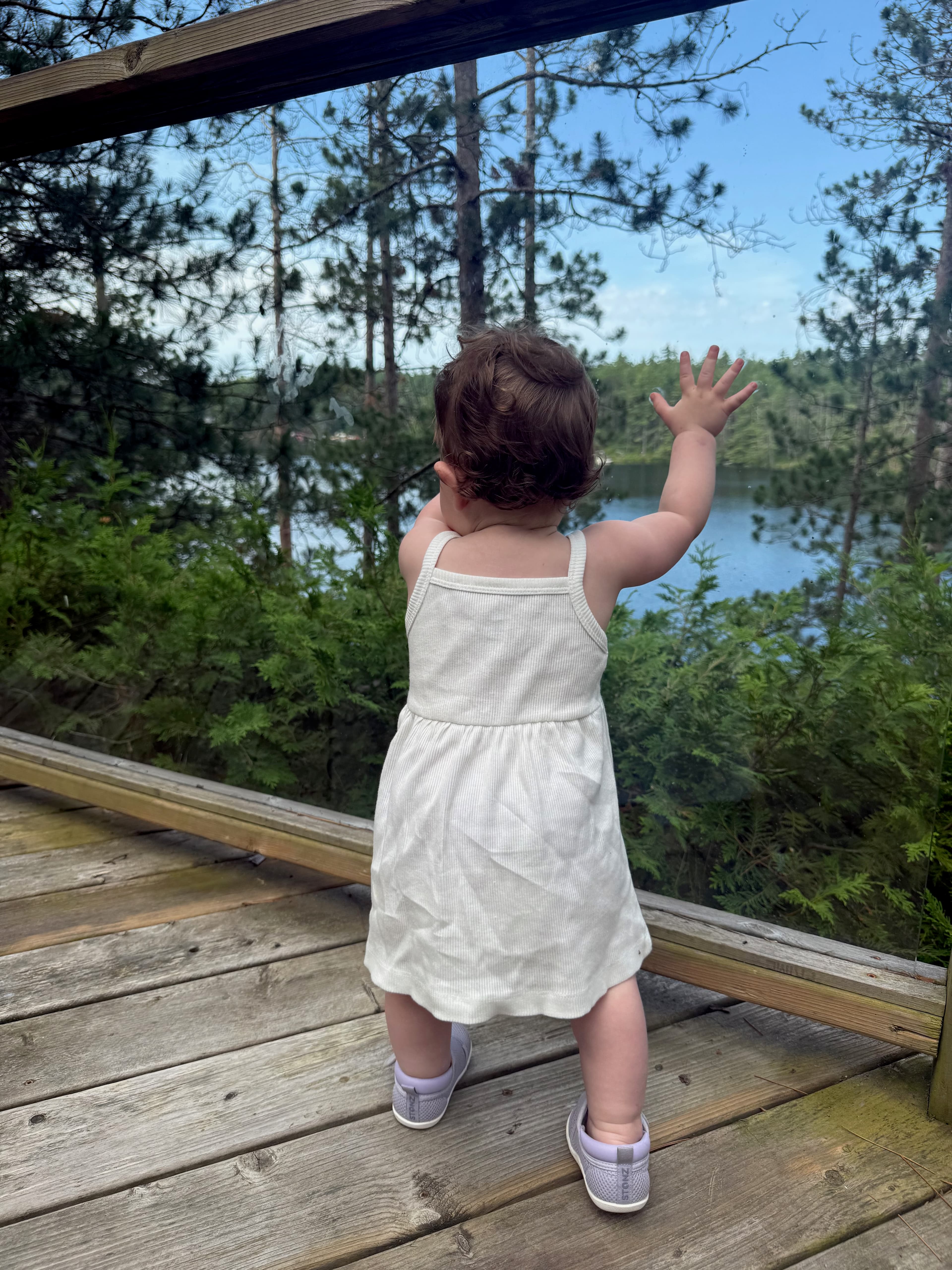 An original candid cottage and lake moment from the family sequence