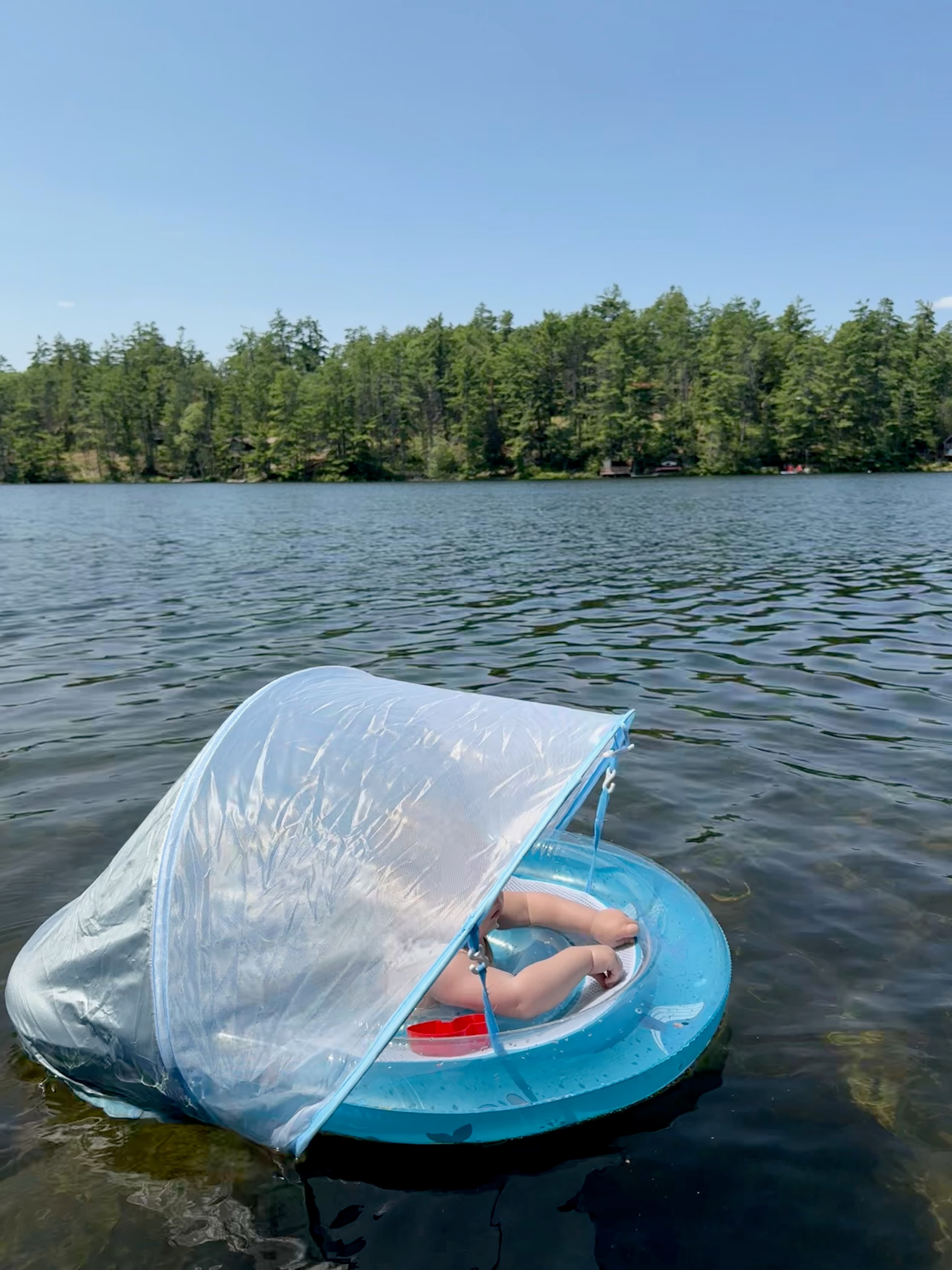 An original candid cottage and lake moment from the family sequence