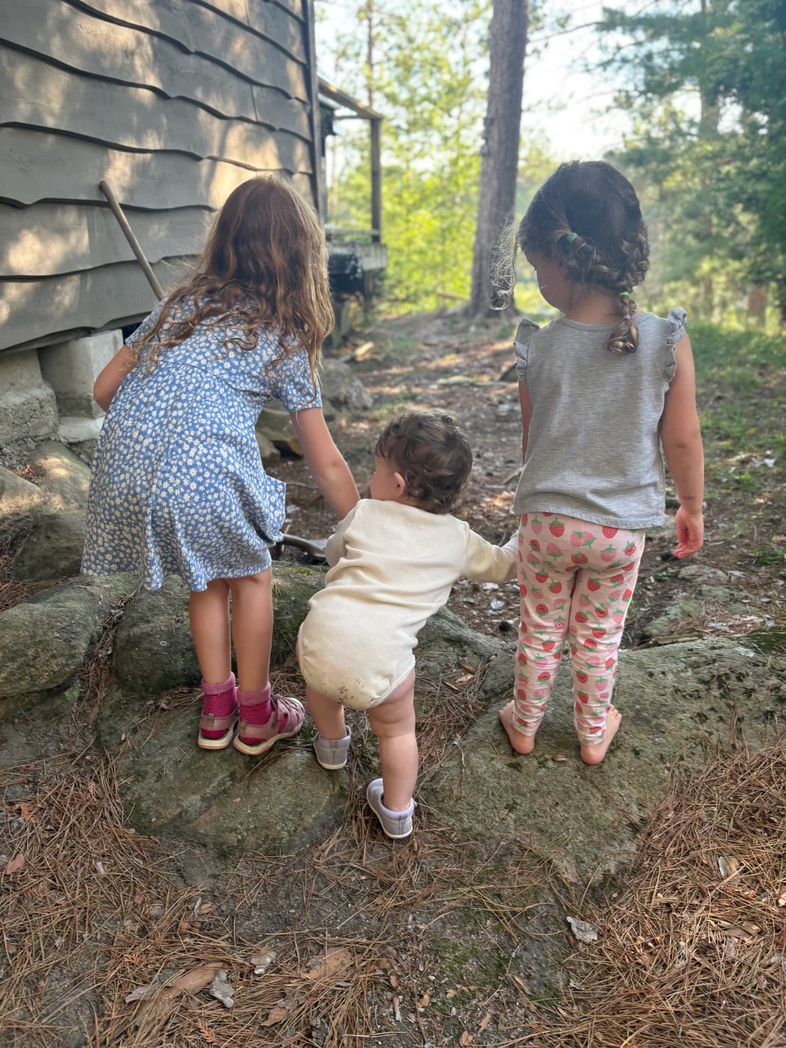 An original candid cottage and lake moment from the family sequence