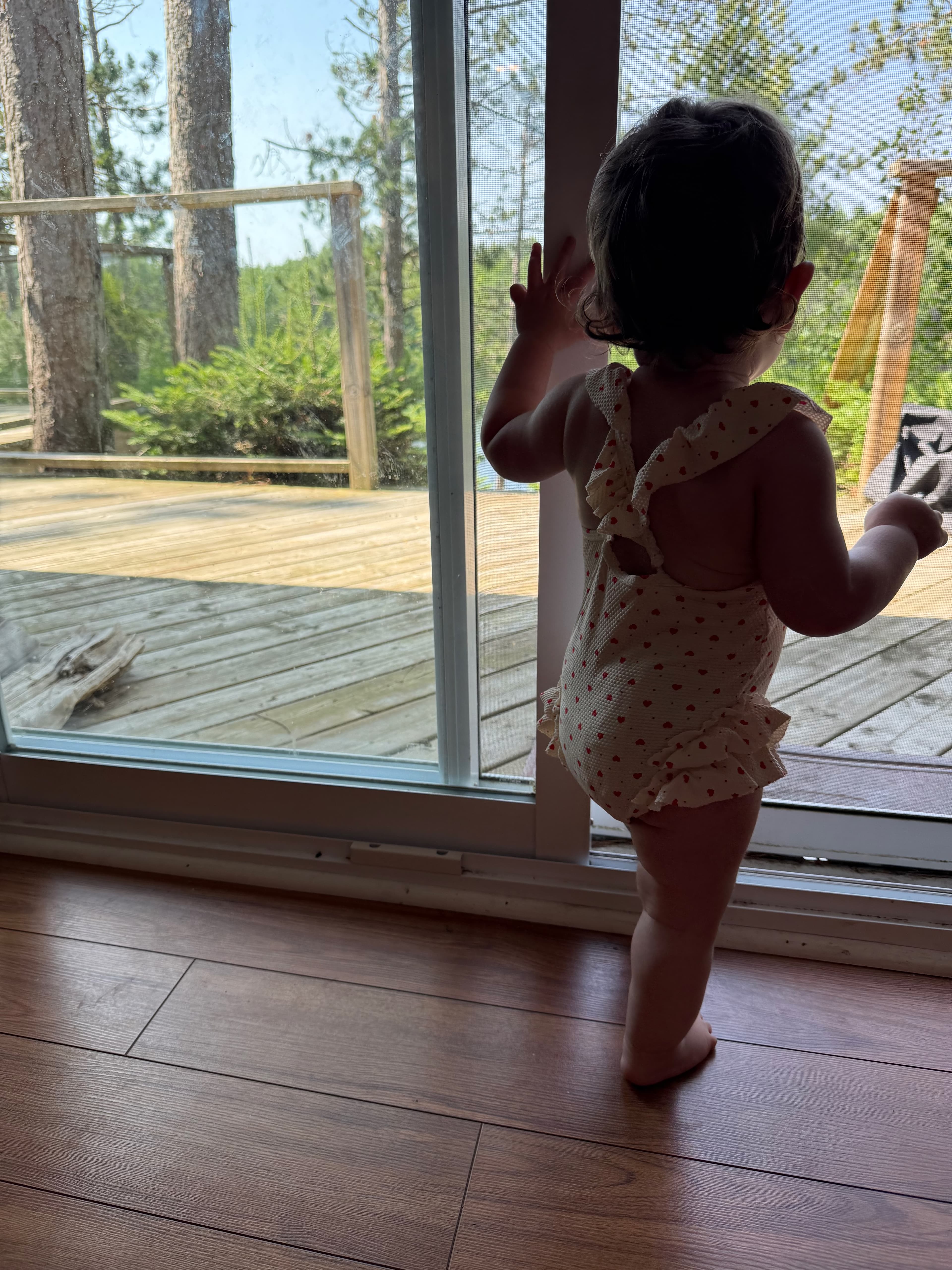 An original candid cottage and lake moment from the family sequence
